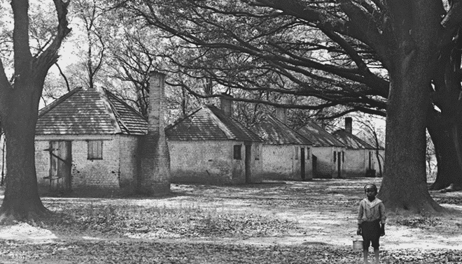 Black and white photo of old slave housing.
