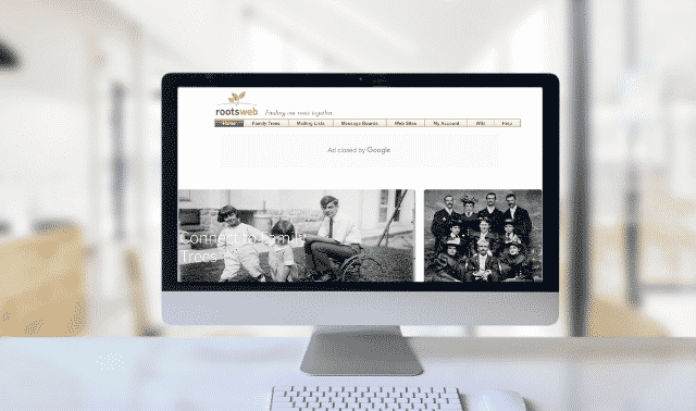 Desktop computer monitor with RootsWeb homepage.