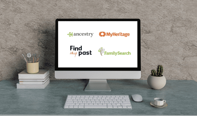Computer monitor showing Ancestry, MyHeritage, FamilySearch and FindMyPast on screen