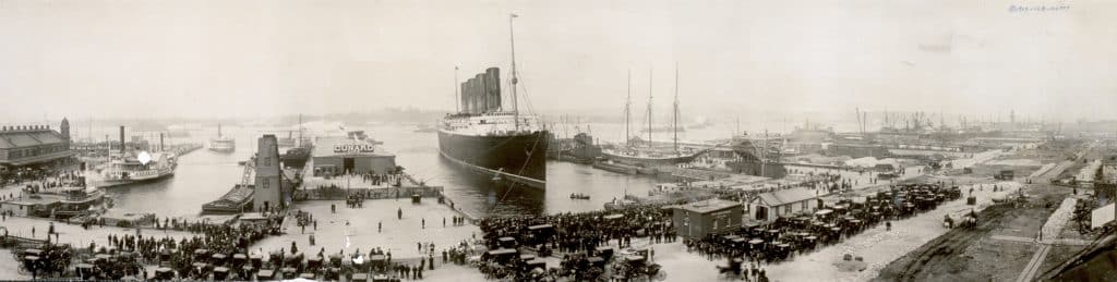Panoramic shot of the Lusitania at a dock.