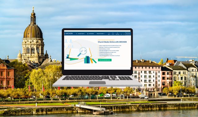 A laptop displaying a website floats in front of a cityscape with historic buildings, a domed structure, and a river in the foreground.