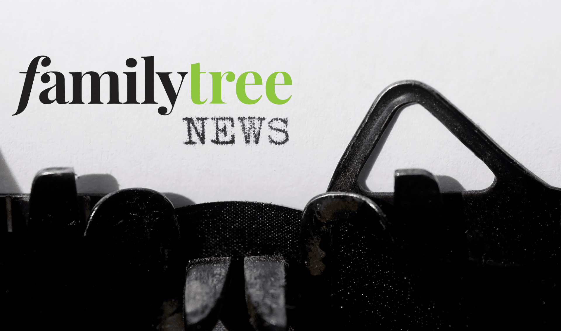 Close-up of a typewriter typing the word "NEWS" on paper, with "familytree" printed in black and green text above—perfect for sharing the latest genealogy news.